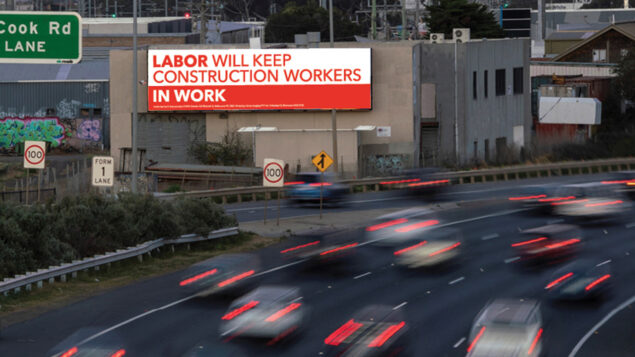 Victorian 2022 election billboard saying Labor will keep construction workers in work.